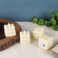 Stylish bubbled LED decorative candle glowing warmly indoors
