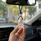 Detailed view of wooden cap on car perfume bottle