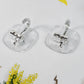 Strong plastic self adhesive wall hooks fixed on kitchen backsplash