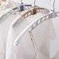 Portable folding hanger shown holding various garments.