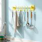 Close-up of utensil hanging rod with removable J shaped hooks in kitchen