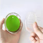 Close-up of the soft silicone bristles on the head massager.