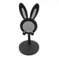 The Bunny Phone Stand in a home office setting, perfect for desk organization.