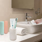 Blue travel toothbrush holder securely containing a toothbrush and toothpaste.