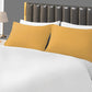 A stack of folded decorative cushion covers, showcasing their various color options.