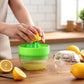 Hand pressing manual citrus juicer extracting juice from orange