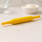 Hands skillfully using the Bombay belan to flatten dough for perfect rotis.