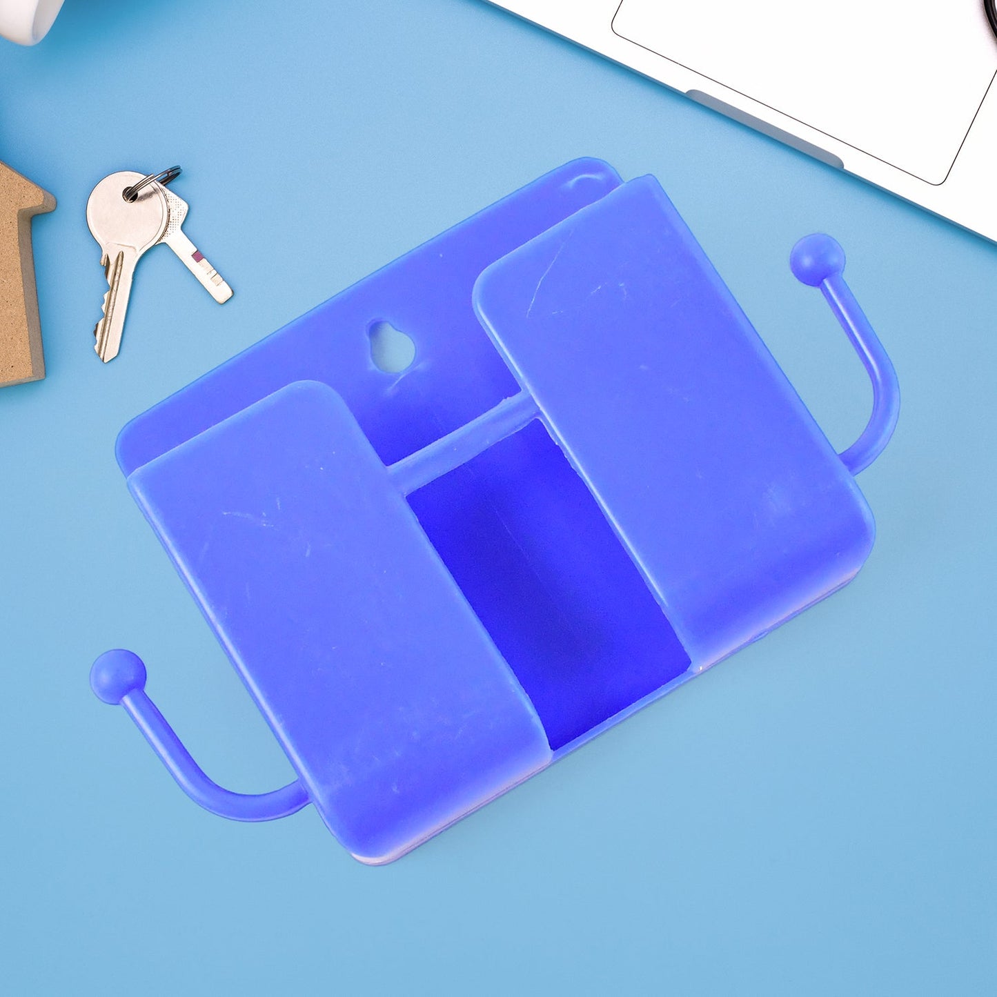 Blue mobile charging stand mounted on wall with hook