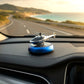 Decorative helicopter fragrance diffuser placed on car dashboard