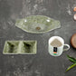 The versatile plastic snack platter and two-compartment chutney bowl from the Ceramic Snack & Tea Set, ready for serving.