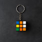Detailed view of a Mini Magic Cube Puzzle keychain with bright, engaging colours.