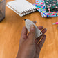 Mini Cloud Box Cutter held in hand for size reference