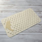 Bottom view showing suction cups securing the anti-slip bath mat