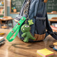 Close-up of silicone strap on dinosaur cartoon keychain