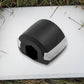 Side profile of the black Jaw Exerciser, showing its compact size.