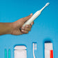 Components of the BrushedUp Electric Toothbrush, including the handle and a replacement brush head.