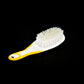 Person demonstrating how to hold the ergonomic Handle Grip Nail Brush for easy cleaning.
