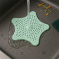 Silicone star shaped bathroom drain strainer installed in sink