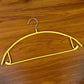 Slim metal hanger with space-saving design for clothes organization