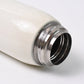 Vacuum-insulated stainless steel water bottle closed with leak-proof cap