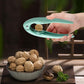 NutEase opener clip for quick and easy shelling of various nuts in kitchen.