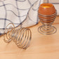 Minimalist stainless steel egg cup holder for breakfast table