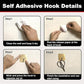 Adhesive heavy-duty hook holding kitchen towels and accessories