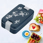 Airtight lunch box featuring removable compartments for easy cleaning and meal prep.