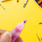 Close-up of glitter glue pen applicator for precise crafting