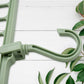 Durable plastic multi-hole hanger displaying its non-slip design for clothes organization.
