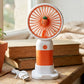 Handheld fan showing USB charging port for convenient recharge