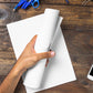 Pack of A4 High Bright Copier Paper in an office setting