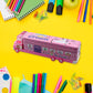Side profile of the double-decker metal pencil box, highlighting its compact and playful design.
