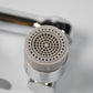 Close-up view of the faucet filter sprayer head, highlighting its dual water flow modes.