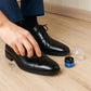 Instant shoe shine sponge housed in compact plastic box, travel-friendly