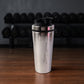Apex branded stainless steel gym shaker bottle with measurement markings