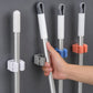 Laundry room with wall-mounted broom holder for cleaning supplies