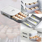 The egg storage box with its drawer partially open, demonstrating smooth operation.