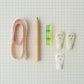 Close-up of wall hanging tools with measuring tape and bubble level