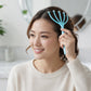 Person enjoying relaxation using five-finger scalp massager