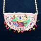 Side profile of the traditional Indian purse, showing its compact yet spacious design.