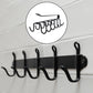 Close-up view of rust-proof iron hooks on the metal cup holder rack.