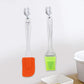 Two-piece silicone spatula and pastry brush set for baking and grilling.