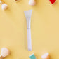 Side view of silicone mask applicator brush with flexible head