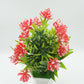 Close-up of the artificial flower plant's vibrant pink flowers and detailed green foliage.