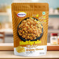 Close-up of crispy roasted multigrain mixture pieces coated in creamy cheese.