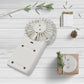 Close-up of the simple one-button control on the portable personal fan.