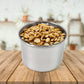 Airtight stainless steel containers filled with coffee beans, tea leaves, and spices, showcasing versatility.