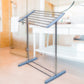 Mobile towel rack positioned indoors, ideal for drying delicate items.