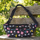 Adjustable strap on floral print waist bag for versatile wear